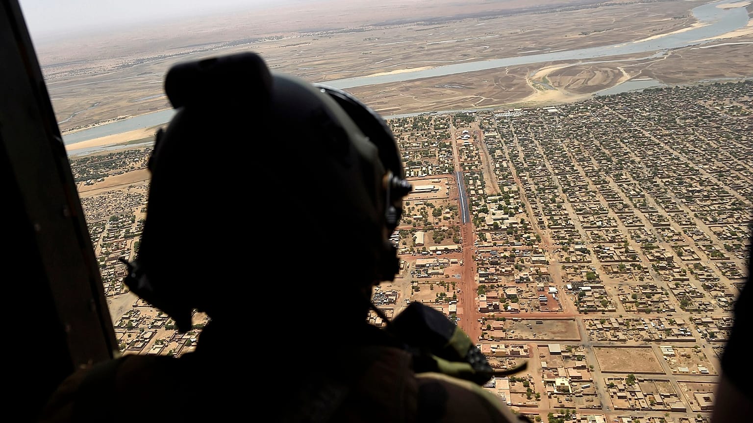 A French soldier stands inside a military helicopter on operation in Mali.