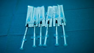 Syringes with Pfizer/Biontech COVID-19 vaccines are ready to be used at the MontLegia CHC hospital in Liege, Belgium