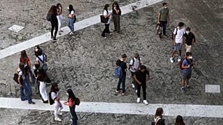 Students enter the Visconti high school, in Rome, Monday, Sept. 14, 2020.
