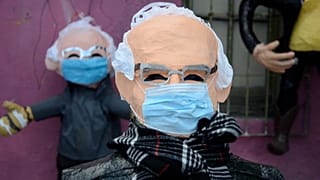 Bernie Sanders piñatas outside workshop