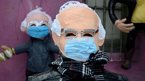 Bernie Sanders piñatas outside workshop 