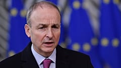 FILE - In this file photo dated Thursday, Dec. 10, 2020, Ireland's Prime Minister Micheal Martin speaks as he arrives at the European Council building in Brussels.