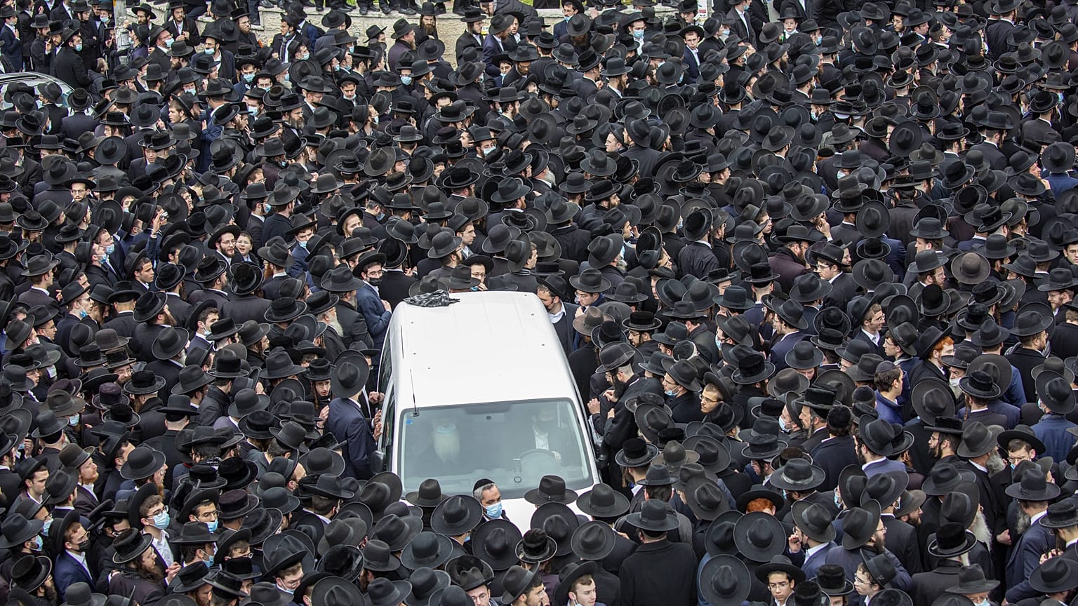 Thousands of ultra-Orthodox Jews participate in the funeral for prominent rabbi Meshulam Soloveitchik, in Jerusalem, Sunday, Jan. 31, 2021. 