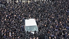 Thousands of ultra-Orthodox Jews participate in the funeral for prominent rabbi Meshulam Soloveitchik, in Jerusalem, Sunday, Jan. 31, 2021. 