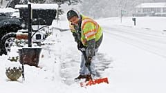 Antwan Wilkerson shovels snow during a winter storm, Sunday, Jan. 31, 2021, in Mechanicsville, Va.