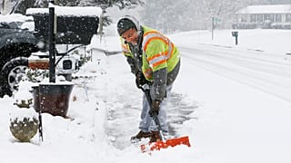 Antwan Wilkerson shovels snow during a winter storm, Sunday, Jan. 31, 2021, in Mechanicsville, Va.