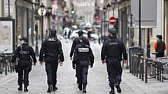 Police officers patrol near Le Printemps shopping centre in Paris as big shopping centres are closed as a measure taken to curb the spread of the Covid-19