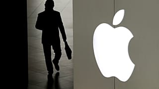 A man leaves an Apple store in Beijing.