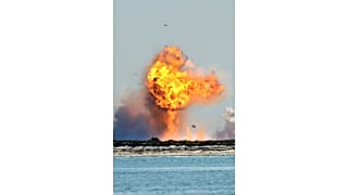 SpaceX's bullet-shaped Starship prototype explodes after crashing while attempting to land following a successful test launch, Tuesday, Feb. 2, 2021, in Boca Chica, Texas.
