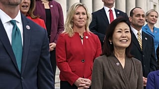 Rep. Marjorie Taylor Greene, R-Ga., centre, stands with other GOP freshmen during an event at the Capitol in Washington.