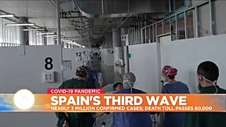 Medical staff look after COVID-19 patient in Spain