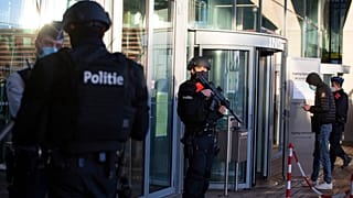 Police patrol outside the courthouse in Antwerp.