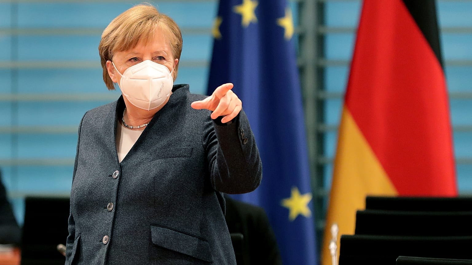 German Chancellor Angela Merkel points as she arrives for the weekly cabinet meeting at the Chancellery in Berlin, Germany, Wednesday, Feb. 3, 2021. 