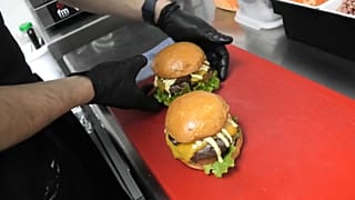 Juan Diego Gaitán prepares burgers in his 'dark kitchen' in Madrid