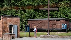 A woman is seen next to a gas chamber at the museum of the former Nazi Death Camp Stutthof, in Sztutowo, July 21, 2020. 