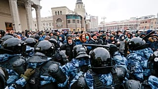 People clash with police during a protest against the jailing of opposition leader Alexei Navalny in Moscow, Russia.