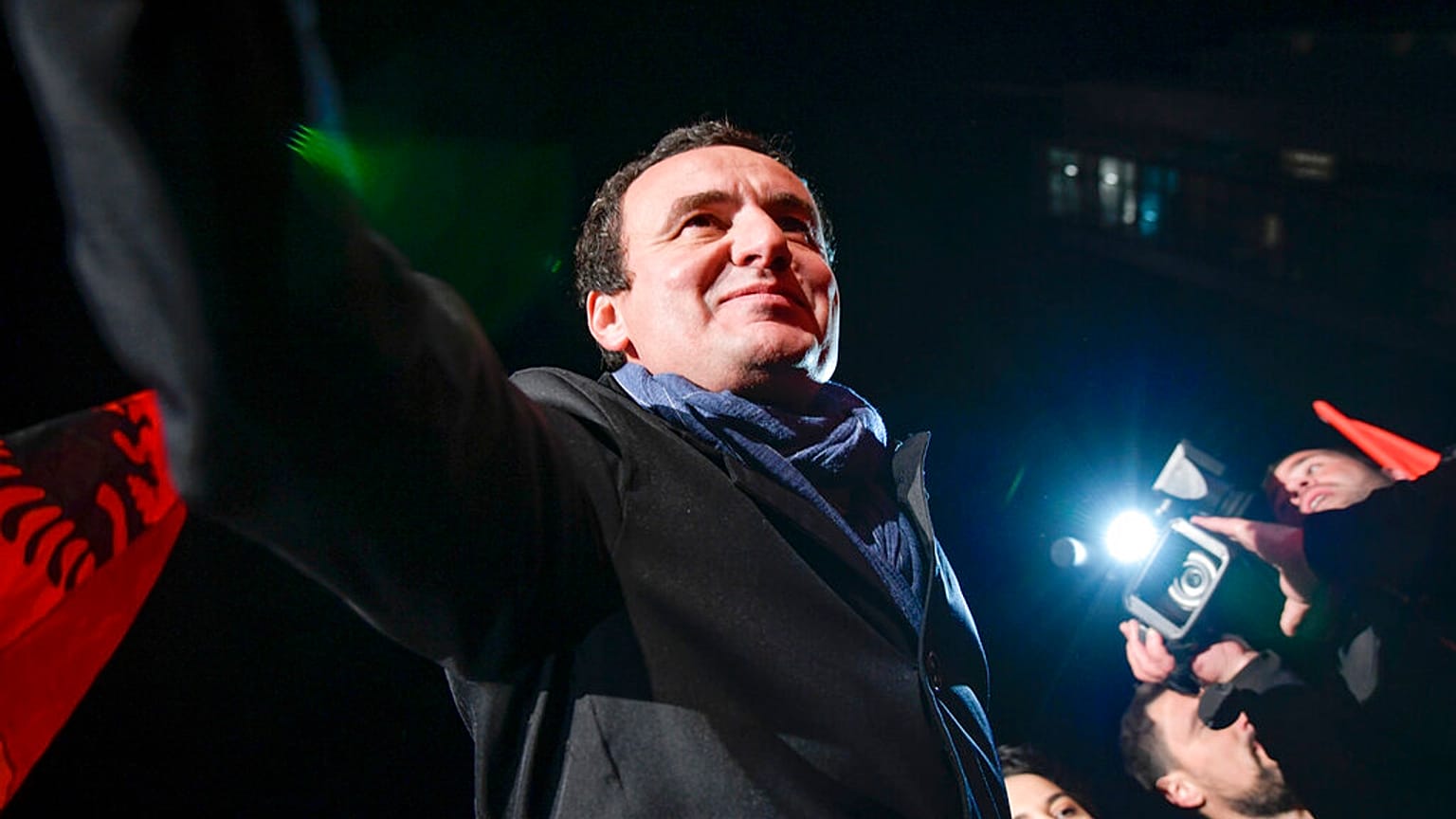 In this Monday, Oct. 7, 2019 file photo, Albin Kurti, leader of the Self-Determination Movement (Vetevendosje), arrives to address a celebrating crowd in the Kosovo capital.