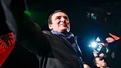 In this Monday, Oct. 7, 2019 file photo, Albin Kurti, leader of the Self-Determination Movement (Vetevendosje), arrives to address a celebrating crowd in the Kosovo capital.