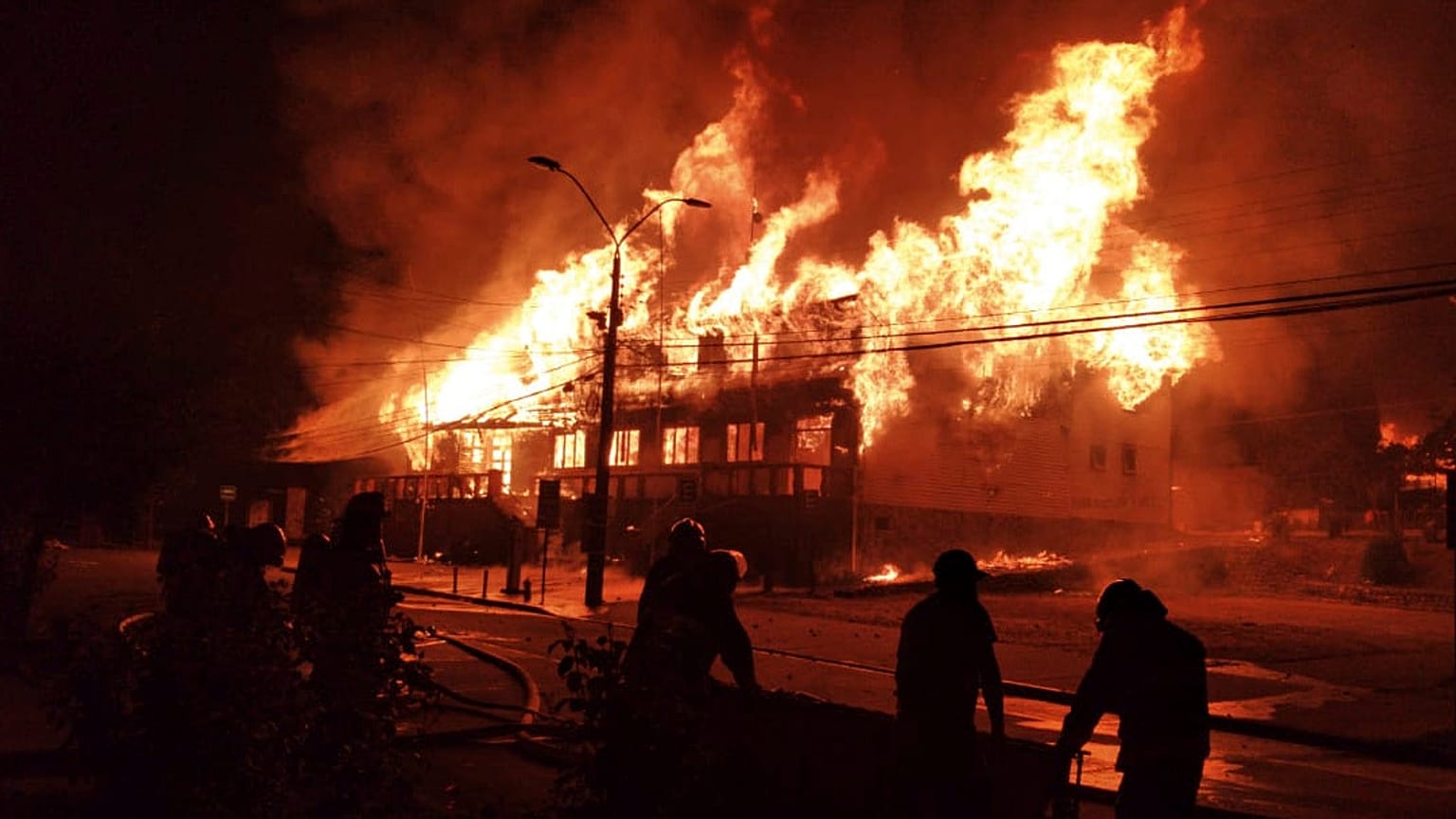 Fire during a protest against the shooting of a street juggler killed by police during an identity check, in Panguipulli, Chile