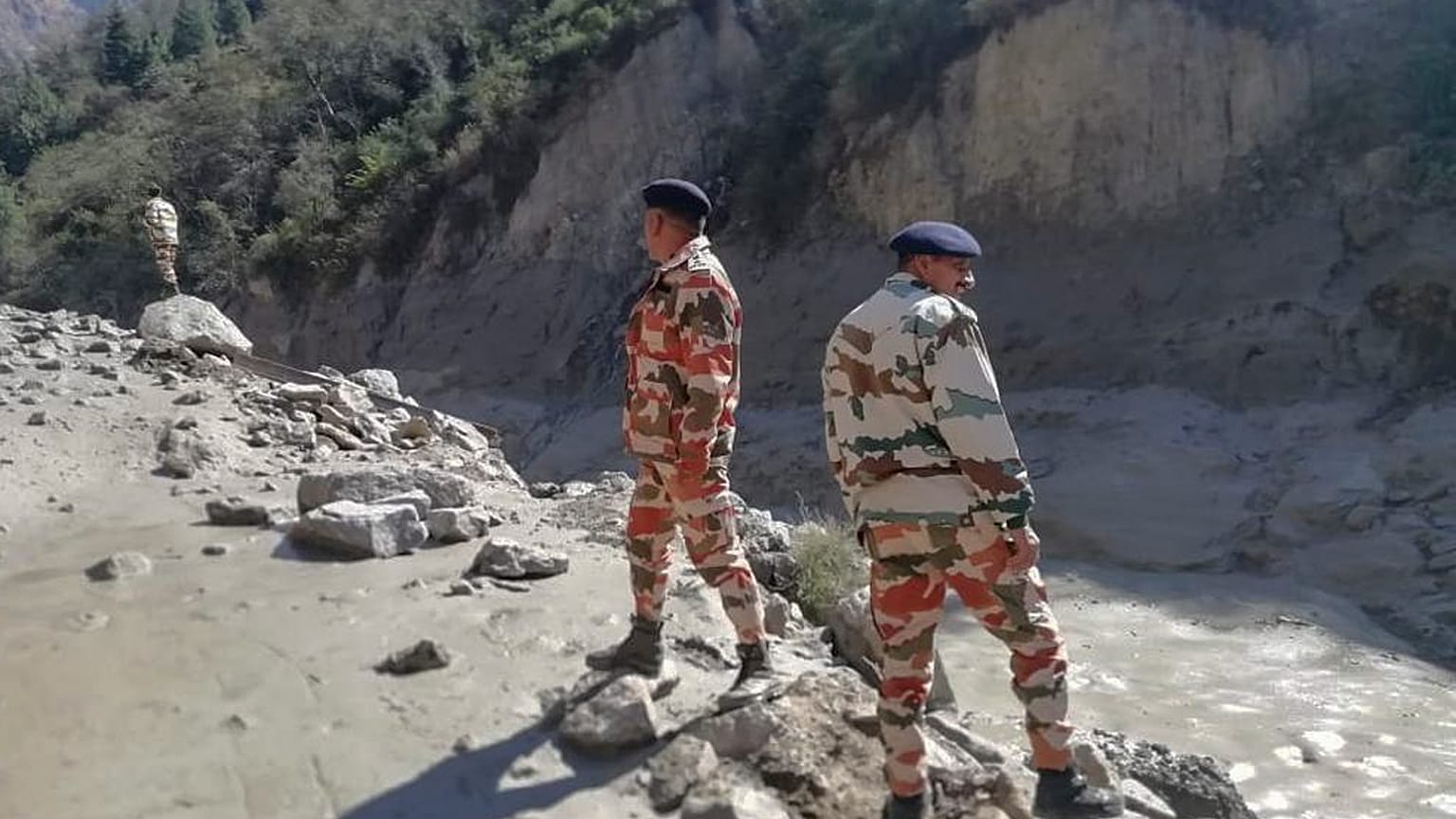 This photograph provided by Indo Tibetan Border Police (ITBP) shows ITBP personnel after a portion of Nanda Devi glacier broke off, Uttarakhand, India, February 7, 2021.