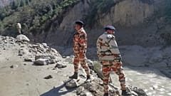 This photograph provided by Indo Tibetan Border Police (ITBP) shows ITBP personnel after a portion of Nanda Devi glacier broke off, Uttarakhand, India, February 7, 2021.