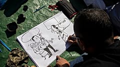 Σκιτσογράφος εν δράσει