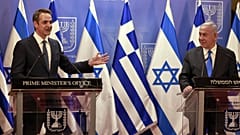 Greek Prime Minister Kyriakos Mitsotakis, left, and Israeli Prime Minister Benjamin Netanyahu deliver statements in Jerusalem, Monday, Feb. 8, 2021. 