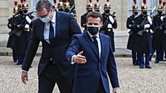 French President Emmanuel Macron, right, welcomes Serbian President Aleksandar Vucic for a working lunch at the Elysee Palace in Paris, Monday, Feb. 1, 2021.
