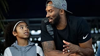 In this July 26, 2018, file photo, former Los Angeles Laker Kobe Bryant and his daughter Gianna watch the U.S. national championships swimming meet in Irvine, Calif.