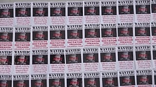 Photos of commander in chief Min Aung Hlaing with "wanted for mass murder" written on it