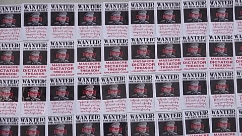 Photos of commander in chief Min Aung Hlaing with "wanted for mass murder" written on it