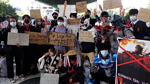 Protesters with super hero costumes protesting