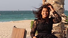 This undated handout picture released on the Facebook page of Saudi activist Loujain al-Hathloul shows her posing for a picture in a dress by a beach.