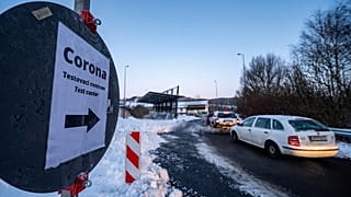 Cars queue in front of a Corona test station at the German-Czech Republic border in Furth im Wald, Germany, Monday, Jan. 25, 2021. 