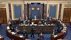  House impeachment manager Rep. Joe Neguse, D-Colo., prepares to speak during the second impeachment trial of former President Donald Trump in the Senate at the U.S. Capitol.