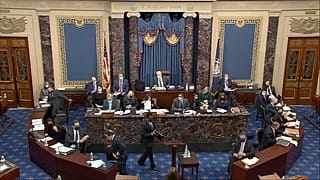  House impeachment manager Rep. Joe Neguse, D-Colo., prepares to speak during the second impeachment trial of former President Donald Trump in the Senate at the U.S. Capitol.