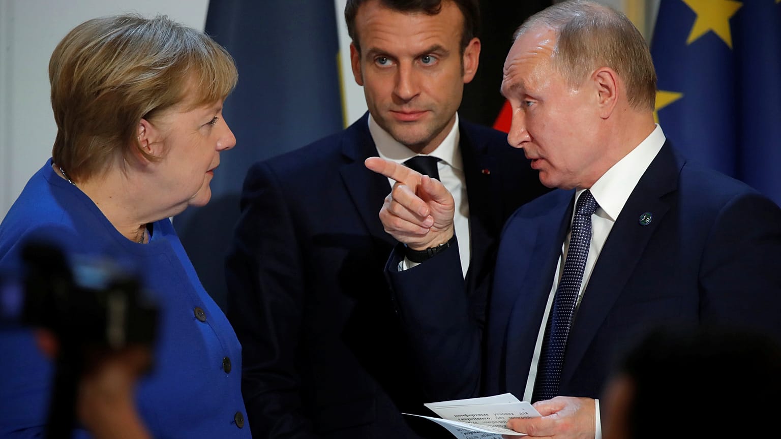 German Chancellor Angela Merkel, French President Emmanuel Macron and Russian President Vladimir Putin 