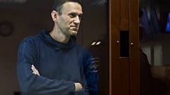 Russian opposition leader Alexei Navalny stands in a cage during a hearing on his charges for defamation, in the Babuskinsky District Court in Moscow, Russia. Feb. 5, 2021., 