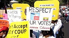 Protesters march across Yangon against the coup