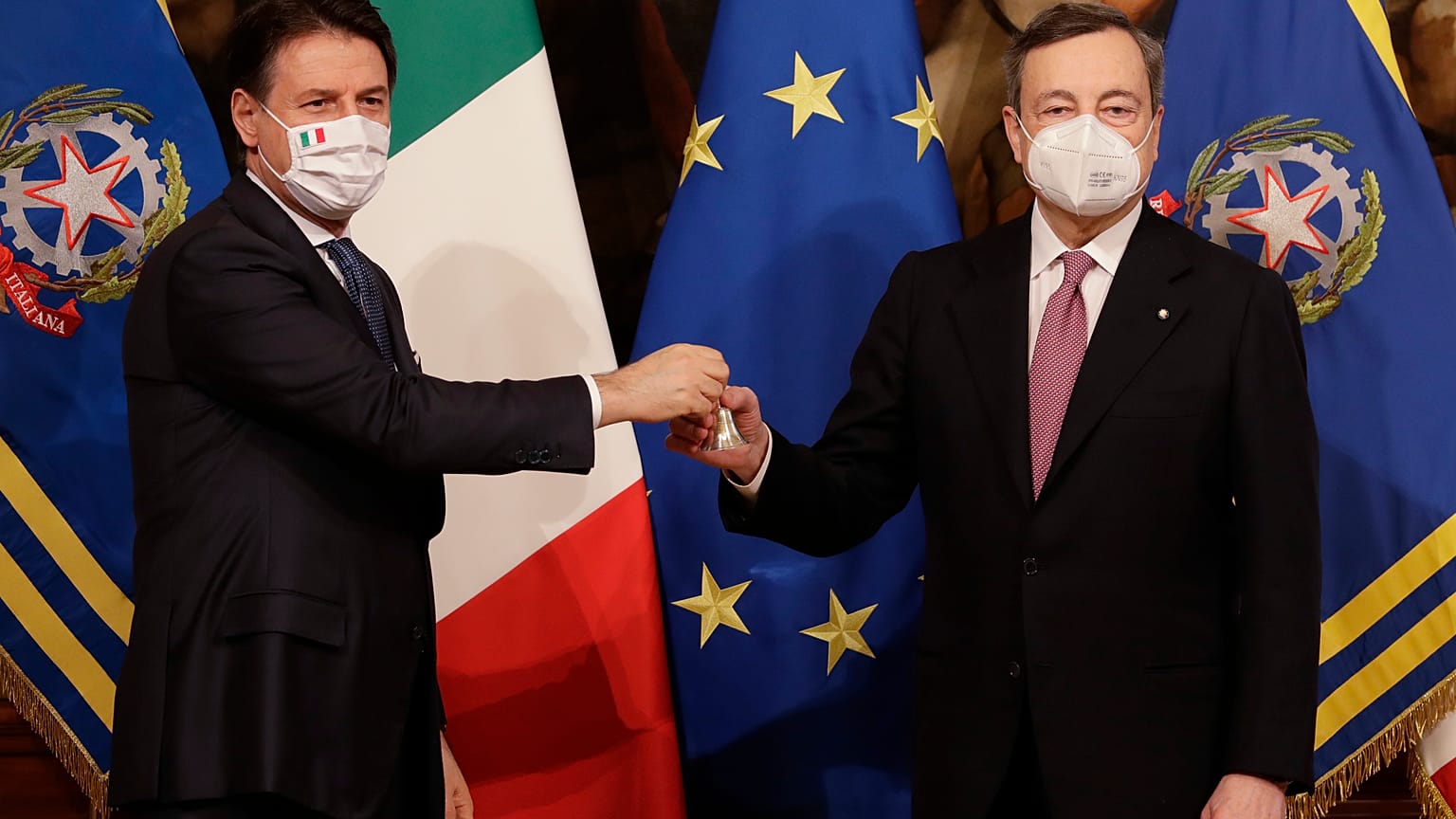 Italian President Sergio Mattarella and Prime Minister Mario Draghi pose with the government's new cabinet of ministers after their swearing-in ceremony