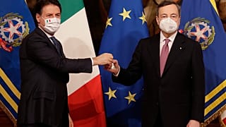 Italian President Sergio Mattarella and Prime Minister Mario Draghi pose with the government's new cabinet of ministers after their swearing-in ceremony