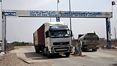 In this April 13, 2015 photo, an Afghan border policeman mans a checkpoint at the Afghan-Iranian border point near Islam Qala in Herat province, west of Kabul, Afghanistan.