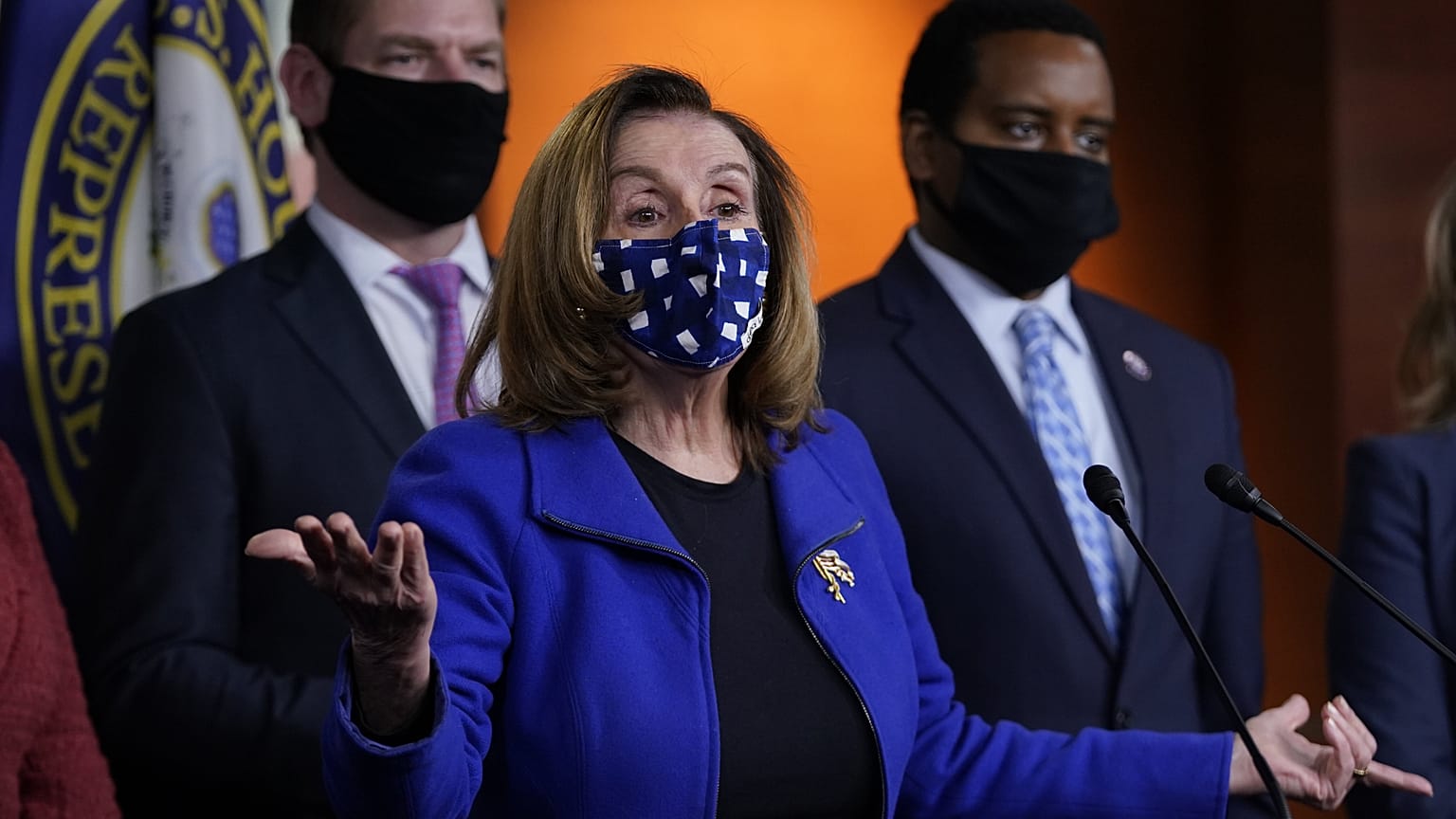 House Speaker Nancy Pelosi of Calif., with impeachment managers Rep. Eric Swalwell, D-Calif., and Rep. Joe Neguse, D-Colo. at a news conference on Capitol Hill in Washington.