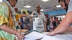 A man casts his vote in Noumea, New Caledonia, Sunday, Oct. 4, 2020, during a referendum whether voters choose independence from France.