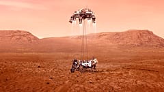 This illustration provided by NASA shows the Perseverance rover, bottom, landing on Mars. 