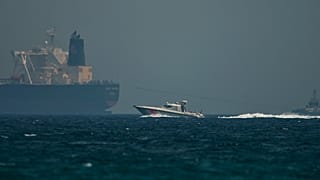 ILLUSTRATION: An Emirati coast guard vessel passes an oil tanker off the coast of Fujairah, United Arab Emirates, May 13, 2019. 
