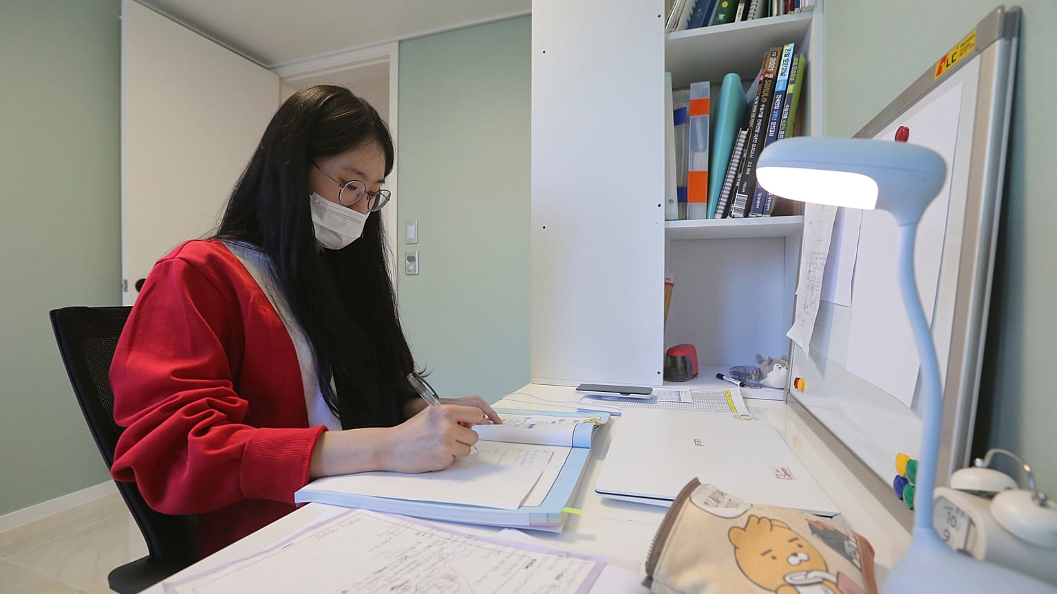 A high school senior studies at her home in Siheung, South Korea.