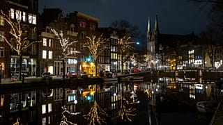 Deserted streets and bridges are seen during curfew in the center of Amsterdam, Saturday, Jan. 23, 2021.