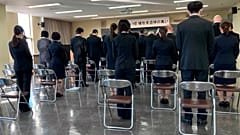 Family members and students attend a memorial ceremony at Toyama Foreign Language College to mourn 12 of their students who died during New Zealand's earthquake 10 years  ago.