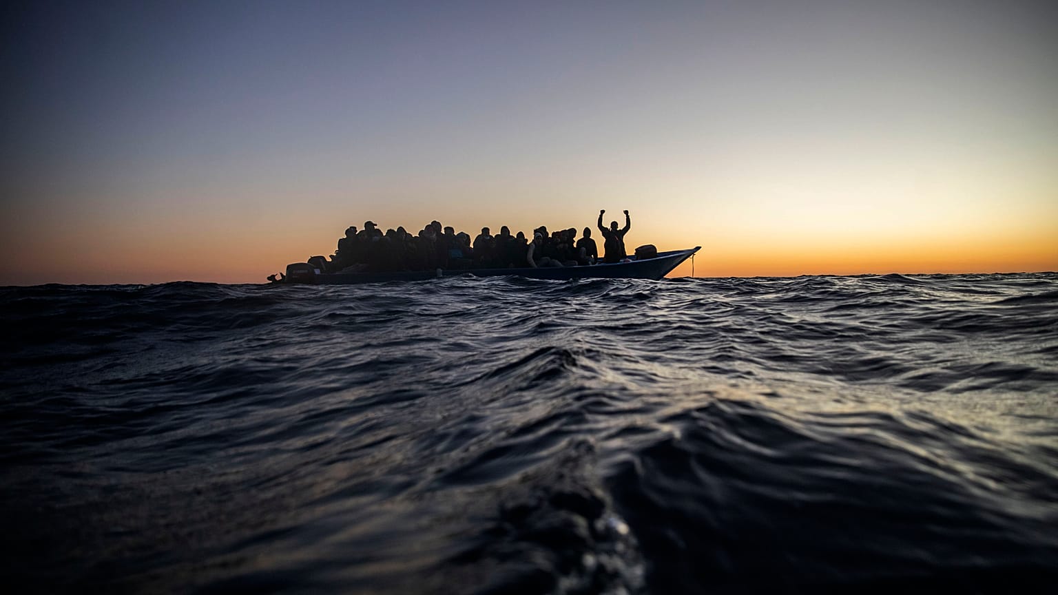 A crowded boat of migrants was intercepted 122 miles off the Libyan coast on February 12, 2021 